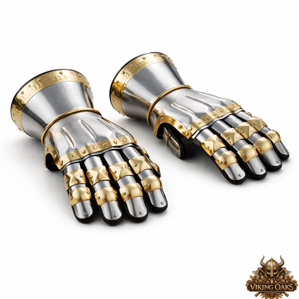 Medieval steel gauntlets with gold trim detailing