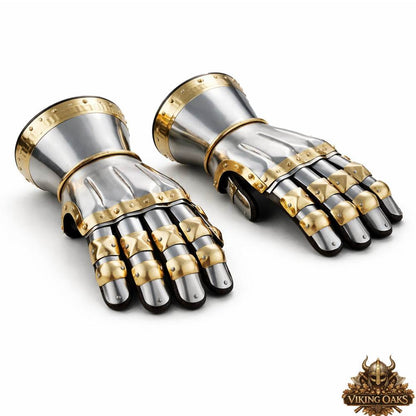 Medieval steel gauntlets with gold trim detailing